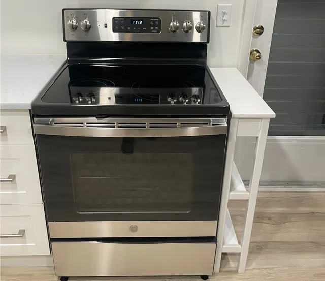 After: The same range, black glass and stainless steel wiped clean.